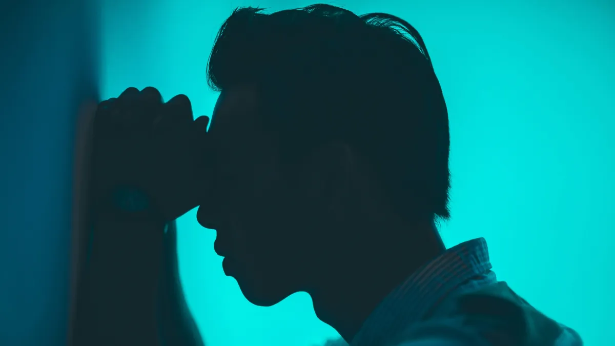 Silhouette head on blue