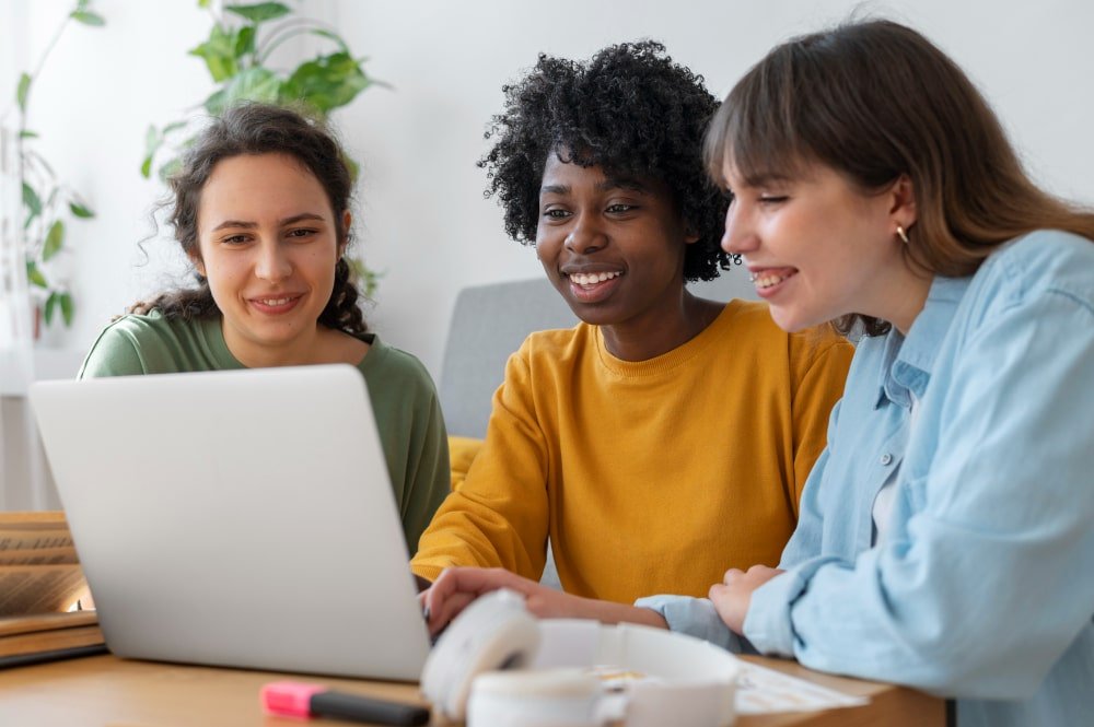 Students looking at a laptop
